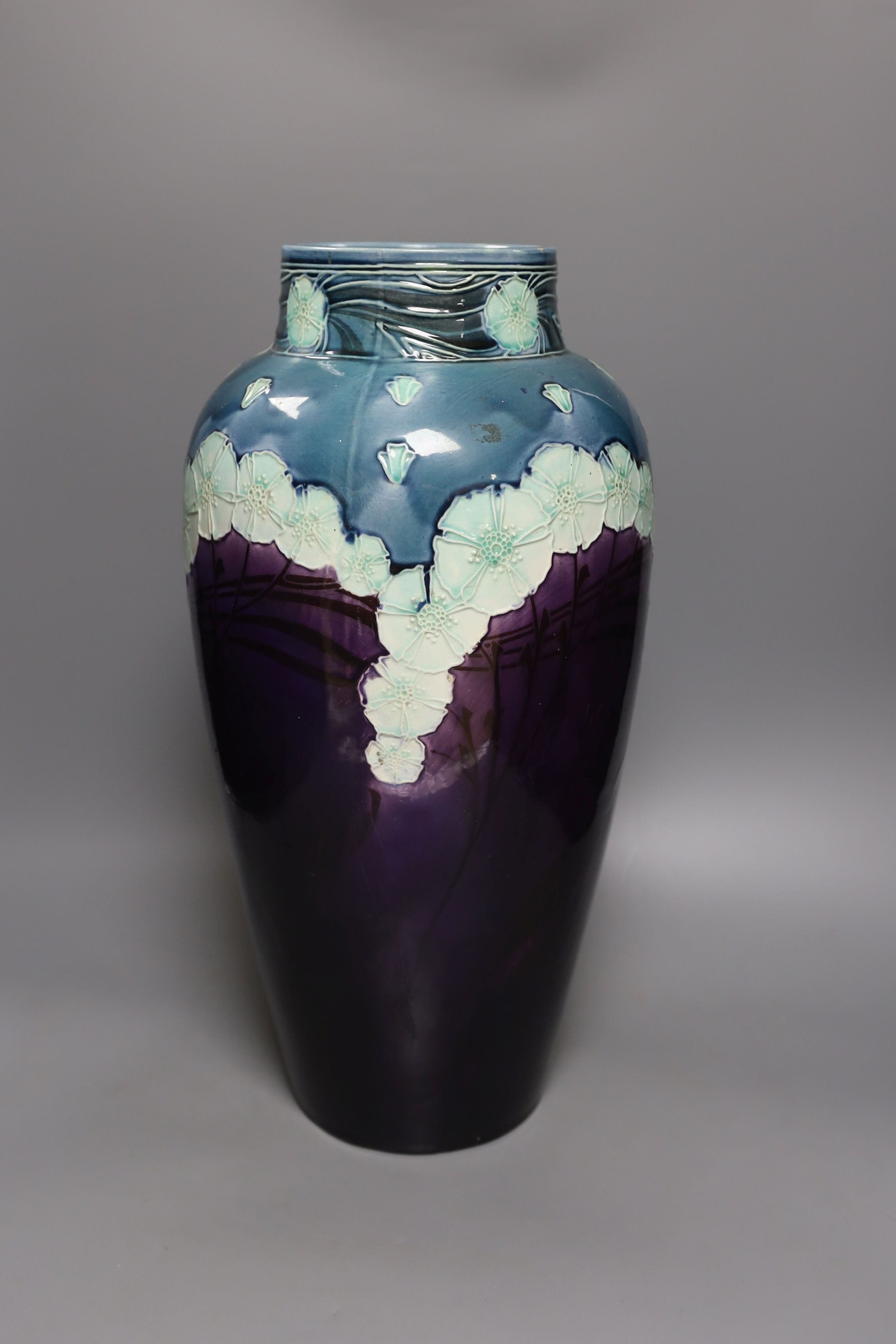 A large Minton Secessionist floral decorated vase, 48 cms high-restored.